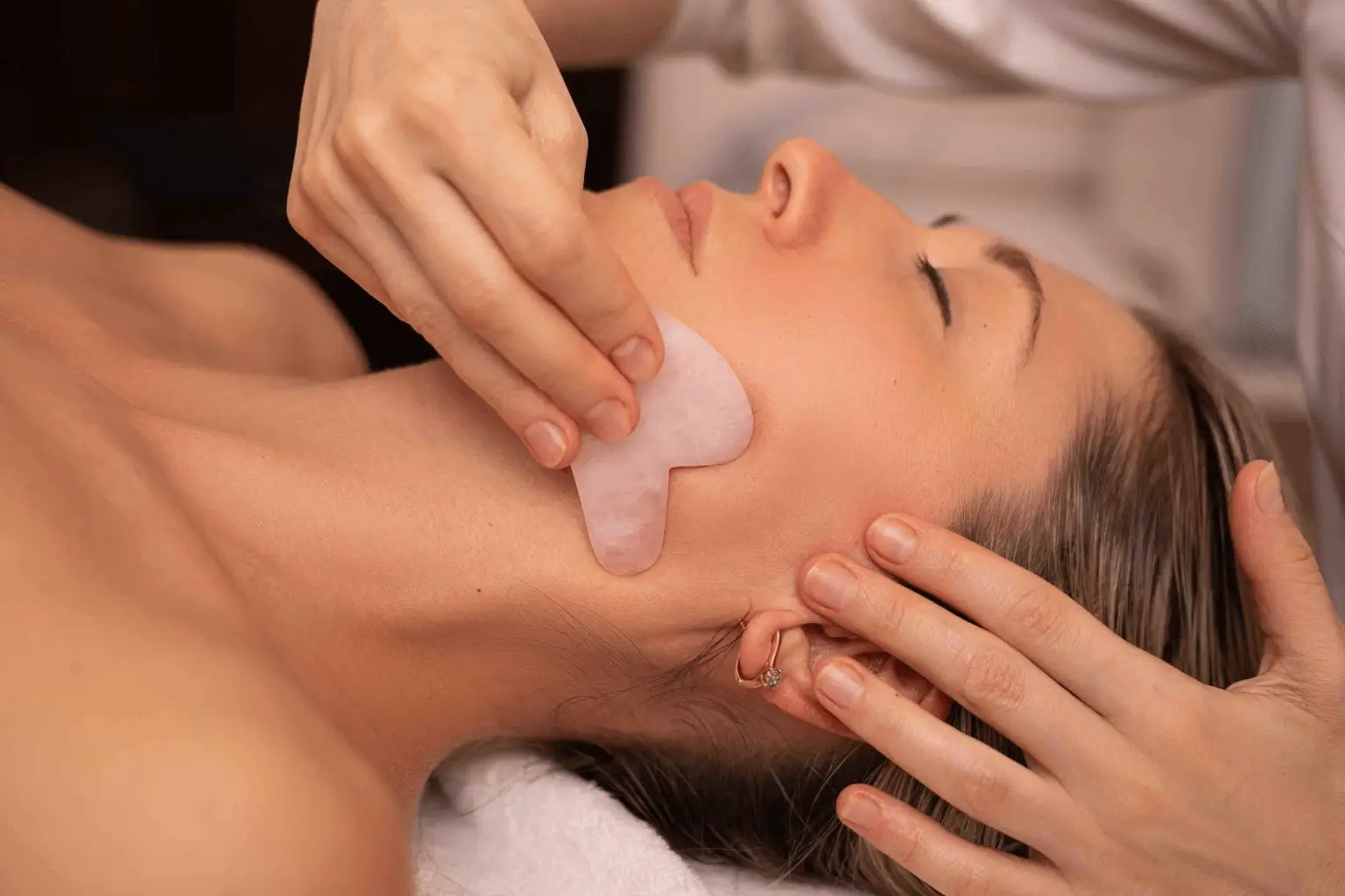 Gua sha facial therapy with neck and shoulder massage